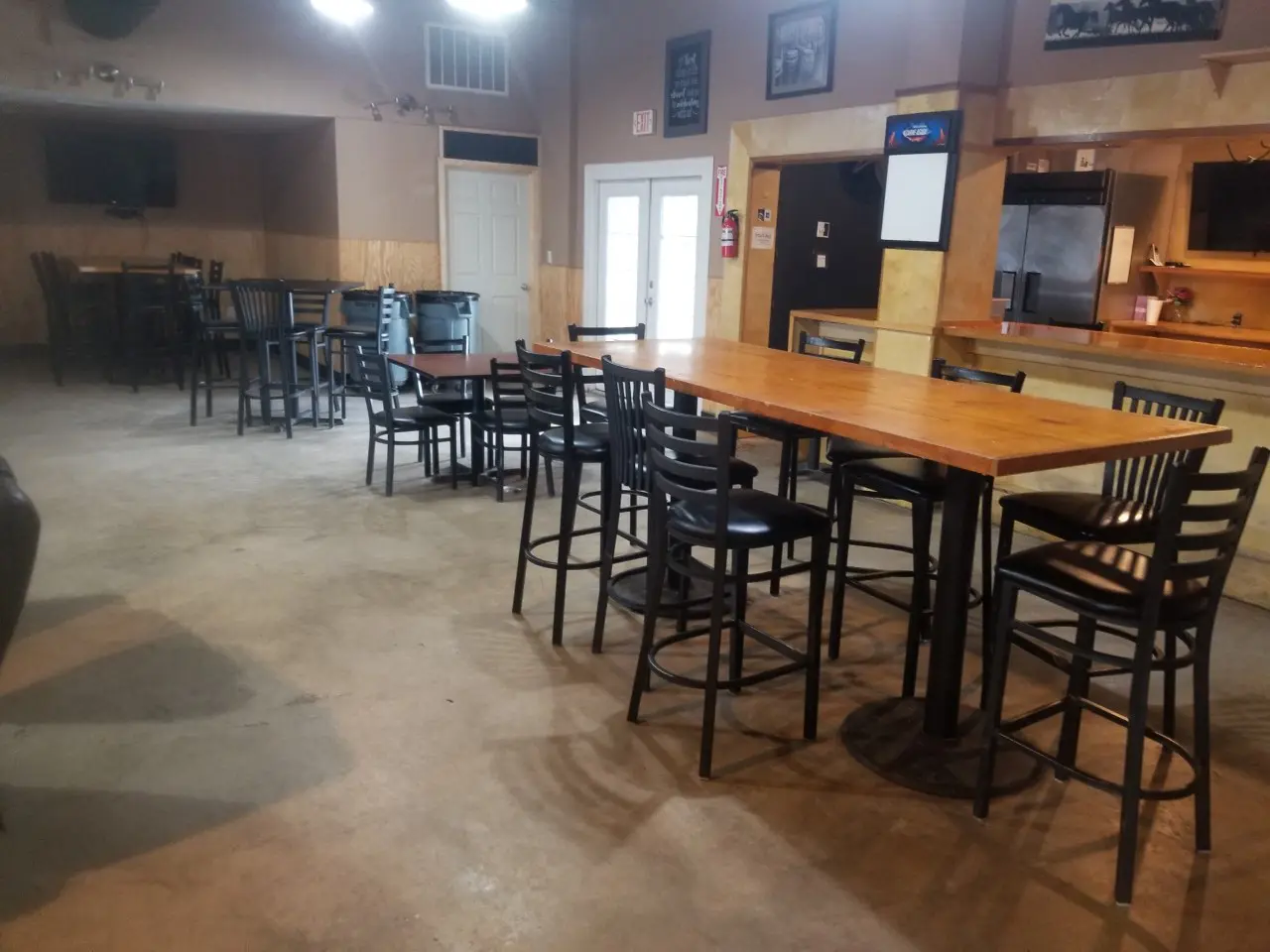 A restaurant with tables and chairs in it